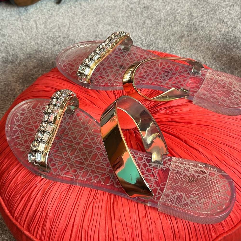 Like new clear sandles with gold strap and beaded